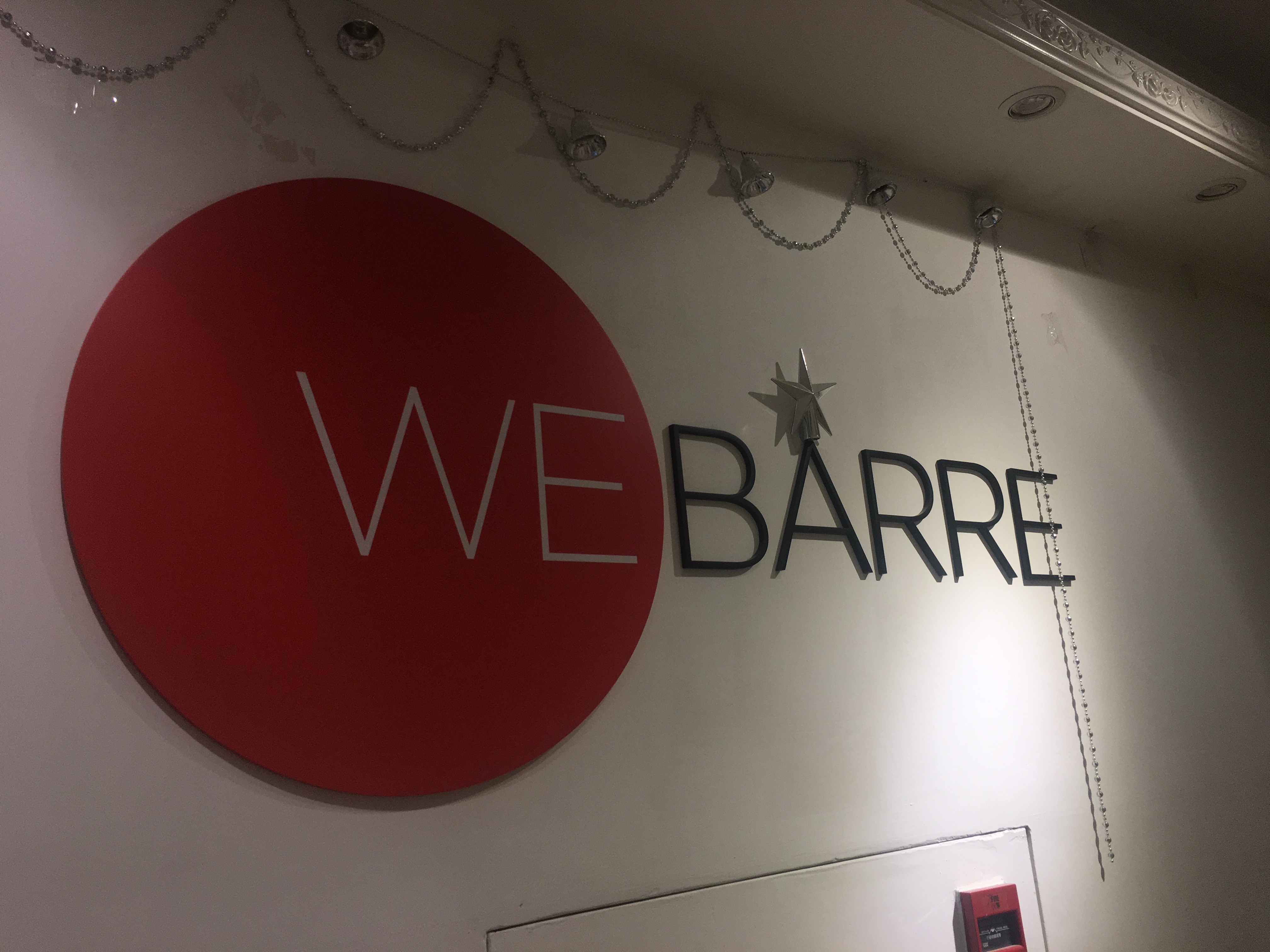 WeBarre sign inside their studio.