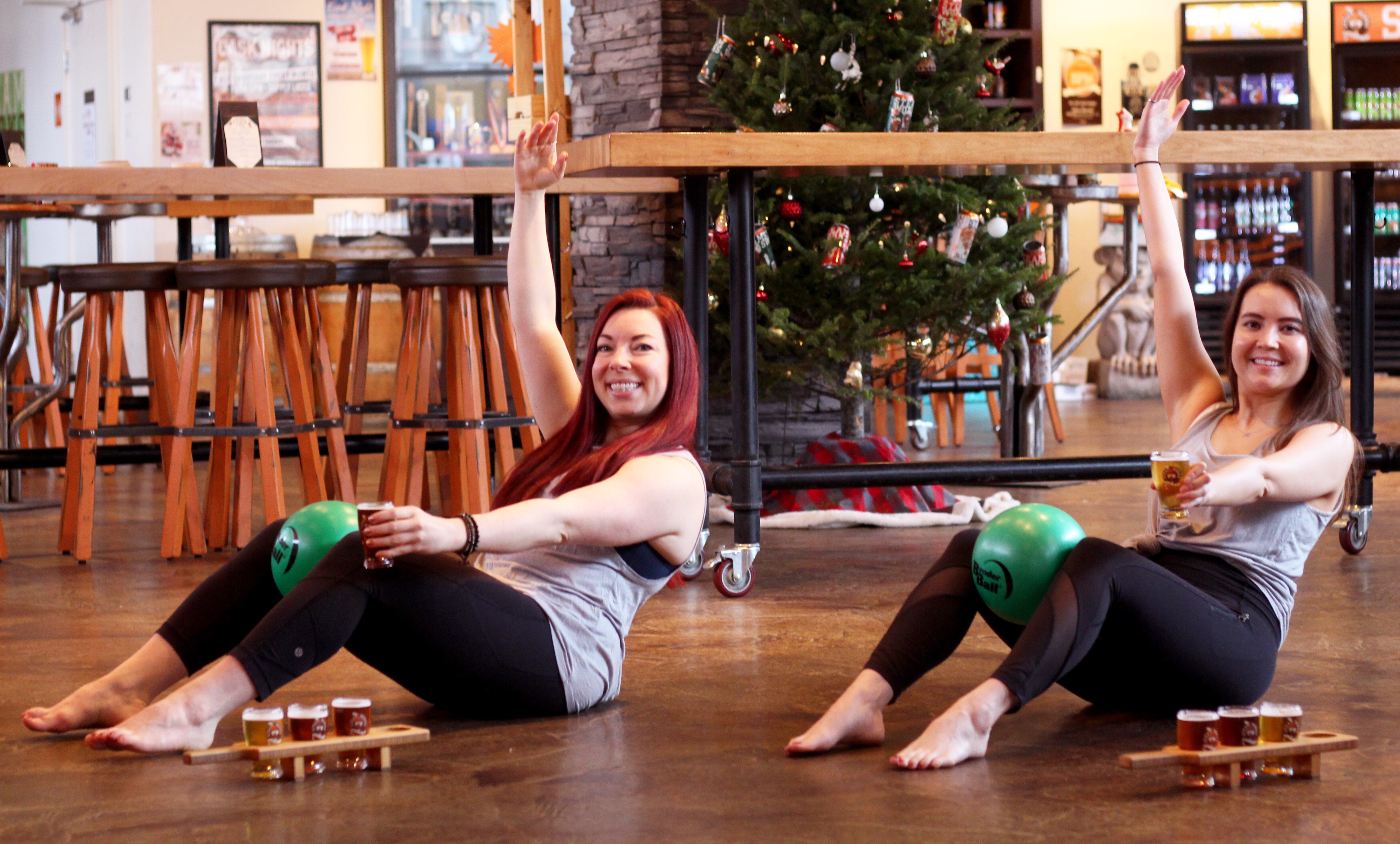 Jill Nadon and a friend inside Steamworks Brewery in Burnaby at a barre pop-up event.