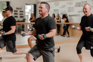 Men taking a barre class