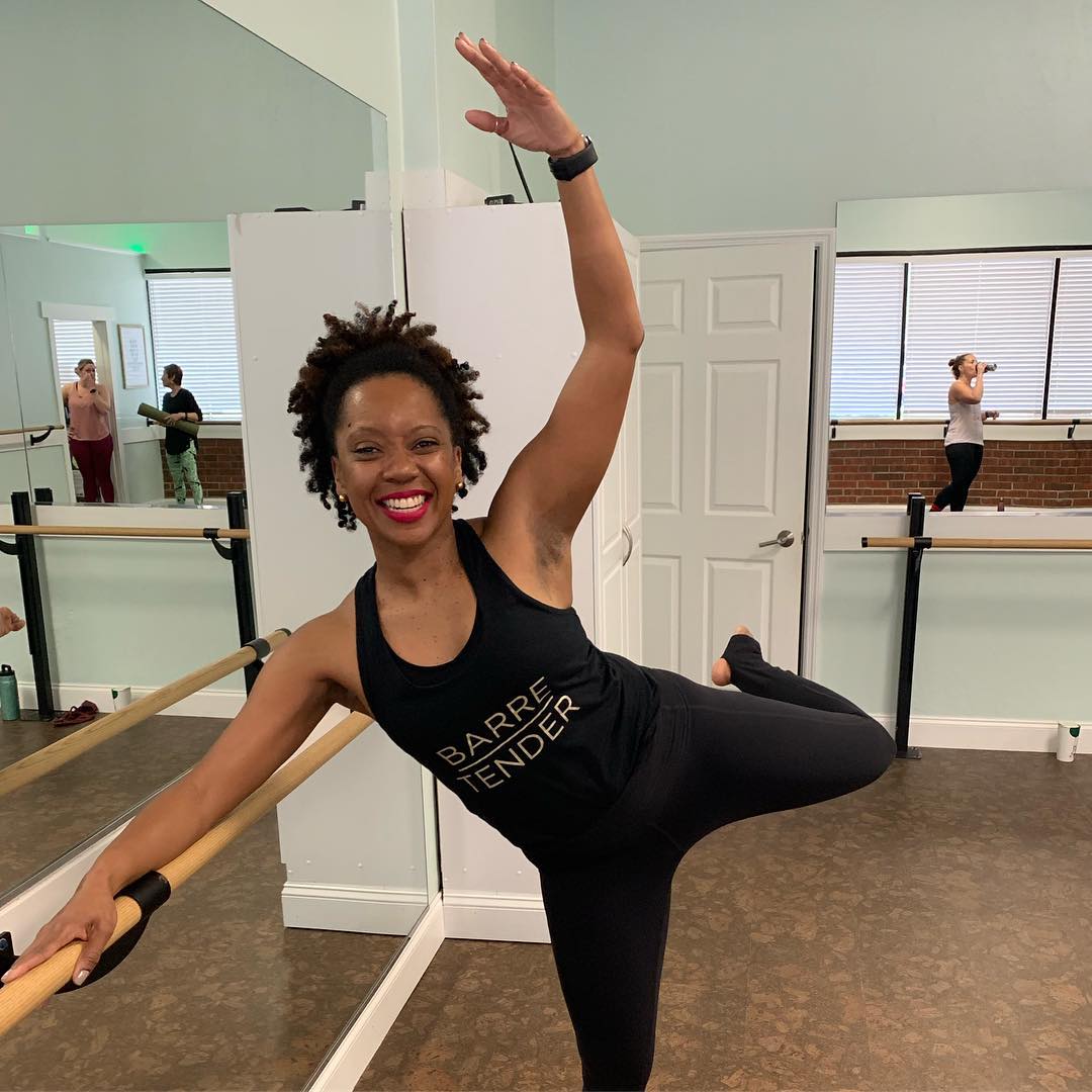 Erica McCray at the barre, in the AUXO Fitness studio in Gainesville, Florida