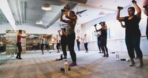 Students at The Bar Method's Wayne, PA location exercising.