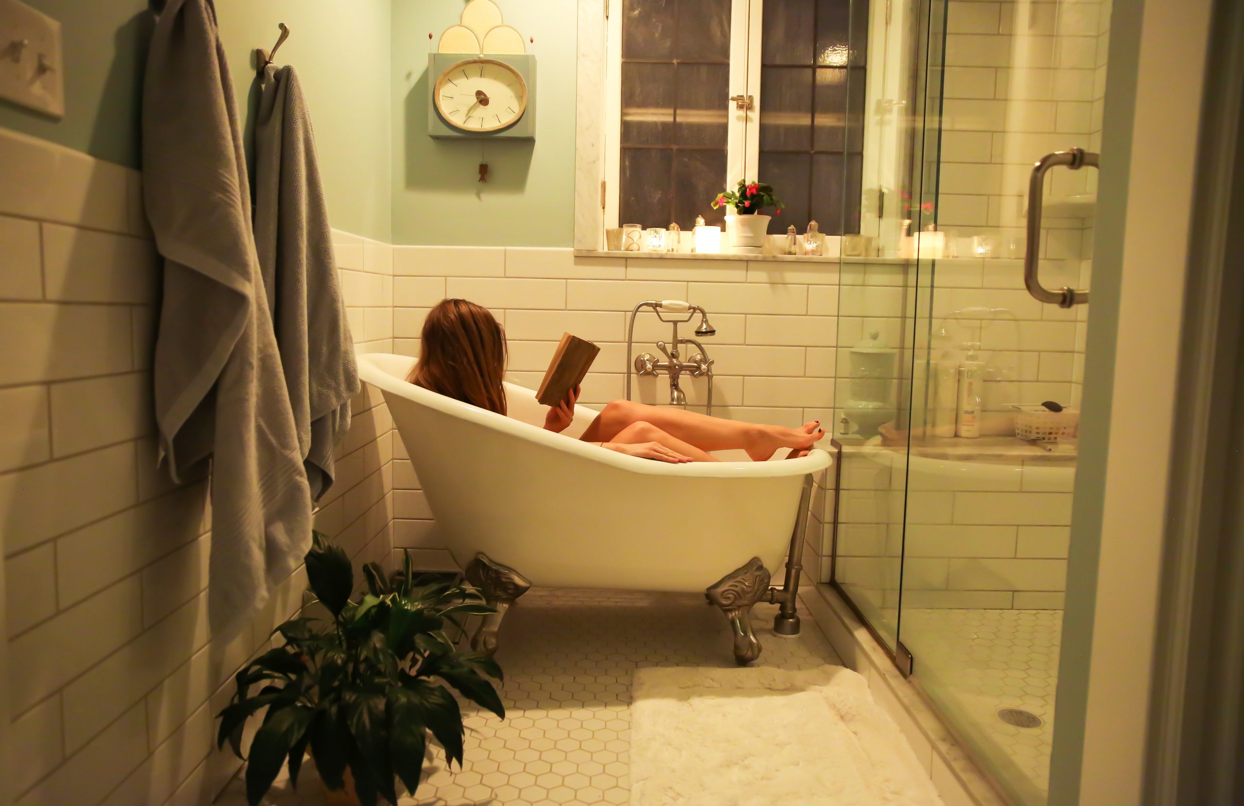 Woman in a bathtub reading