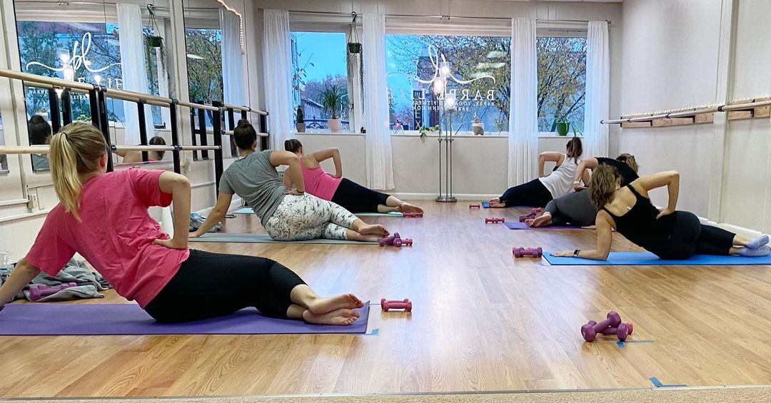 Women workout in the Barre Life studio in Manchester, NH.