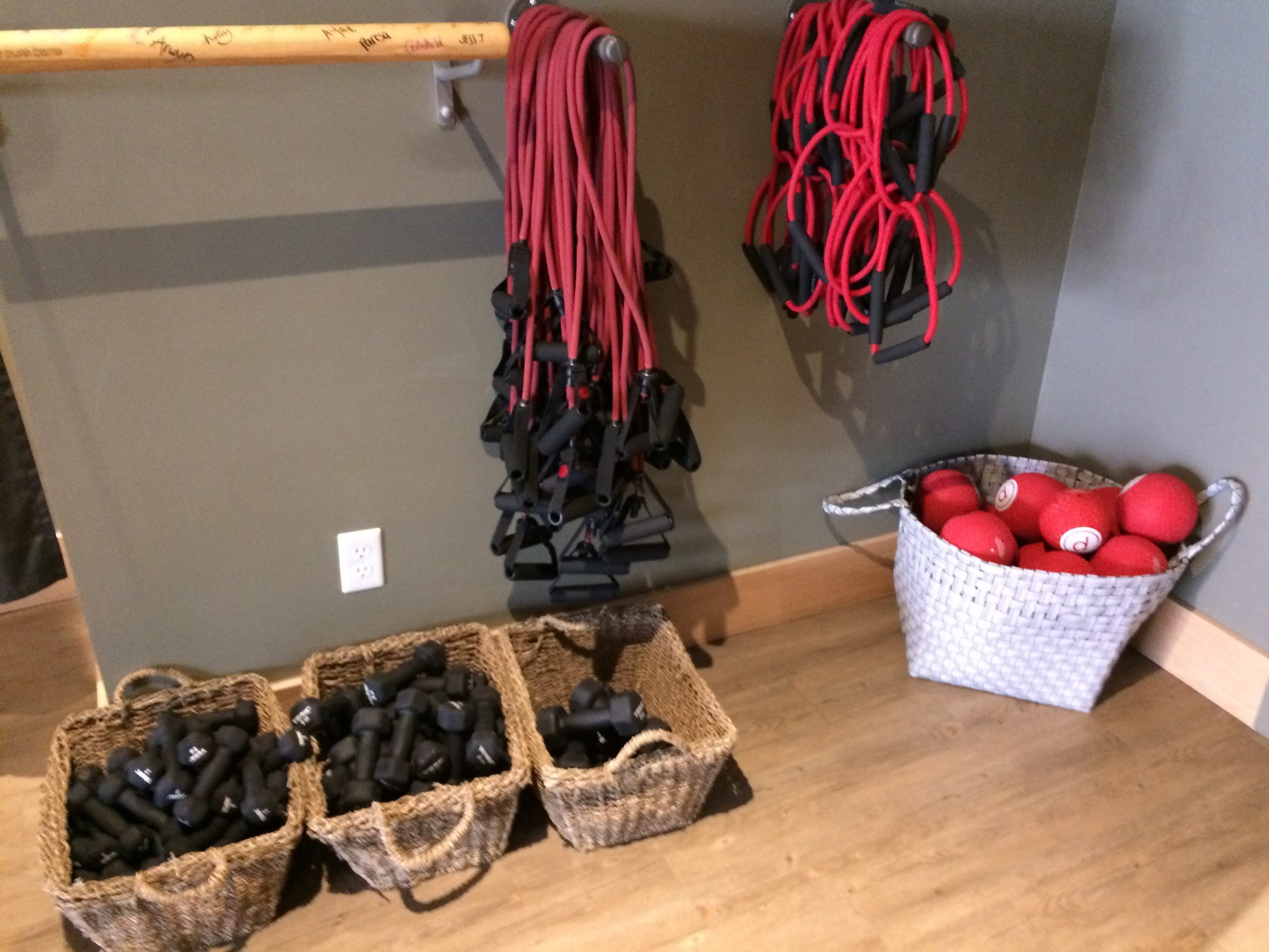 Pure Barre props in the studio, including weights, resistance bands and balls.