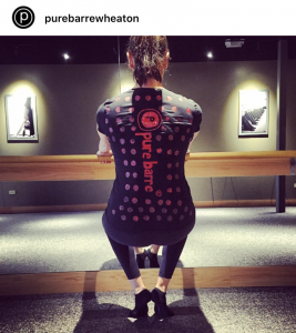 A woman is dressed up as a pair of Pure Barre sticky socks.