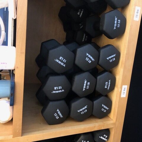 Heavy weights on a shelf at barre3